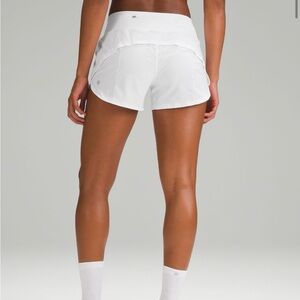 selling on my depop. speed up lululemon 4” shorts. black with blue waistband.